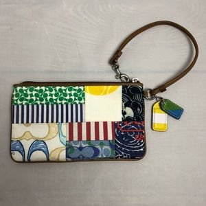 Coach Zip Corner Clutch.